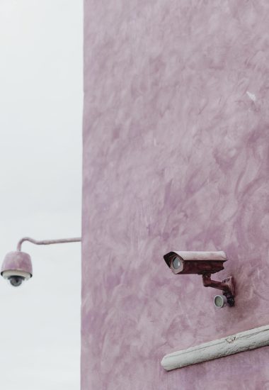 Pink wall with a CCTV